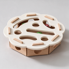 PuzzleFurr wooden cat toy with the sisal scratch pad in the middle of the board